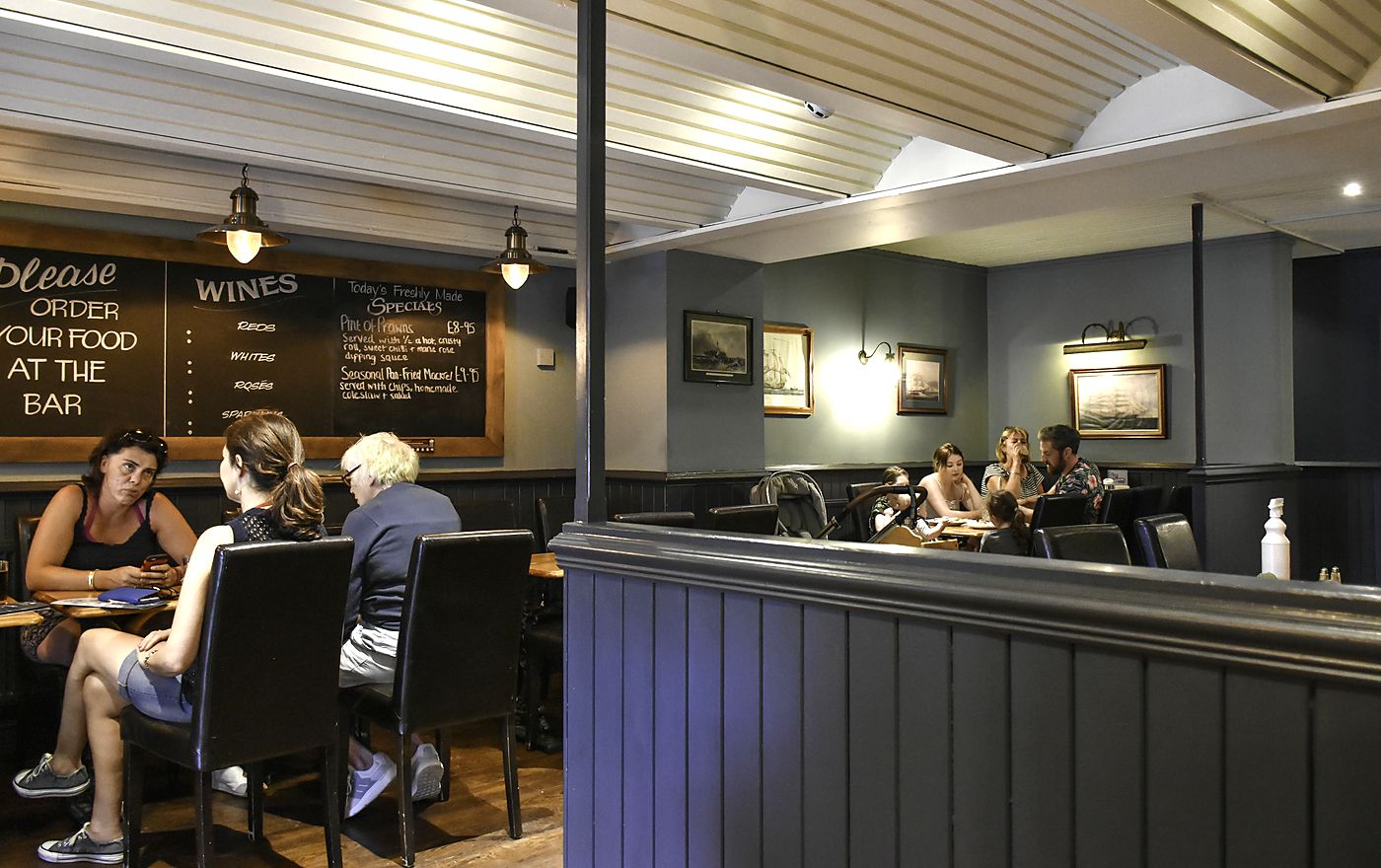 Diners in the Captains Table dining room, Saundersfoot — order your food at the bar
